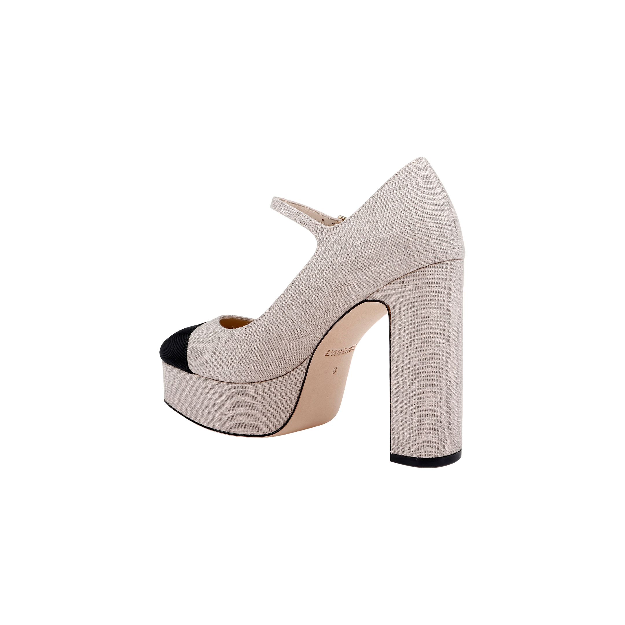 The Lilles Platform Pump is a high-heeled Mary Jane featuring beige fabric, a black toe cap, block heel, square toe, and an ankle strap, shown against a plain white background.