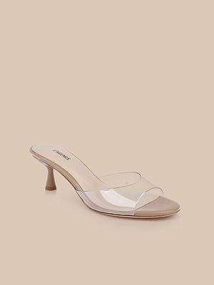 The Esther Kitten-Heel Mule features a beige patent leather heel and a clear vinyl upper strap, showcased on a plain beige background.