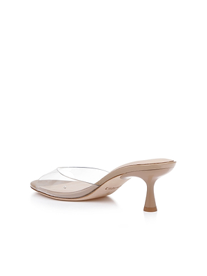 The Esther Kitten-Heel Mule is a neutral patent leather shoe with a clear vinyl strap across the toe, featured against a white background.