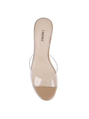 The Esther Kitten-Heel Mule features a clear vinyl upper, transparent strap, and a neutral patent leather nude sole. LAGENCE is printed on the insole, with the shoe shown against a plain white background.