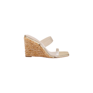The Farrell Wedge Espadrille features a beige braided raffia wedge heel, two clear straps across the foot, and an open square toe, showcased on a white background.