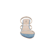 The Ludovica Kitten-Heel Sandal is a single open-toe mule featuring a denim front strap, two clear vinyl straps across the top, and a beige insole, displayed against a white background.