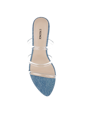 The Ludovica Kitten-Heel Sandal features a pointed denim toe, three clear vinyl straps, and a beige LAGENCE insole—perfect for minimalists. Photographed against a white background.