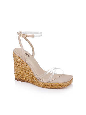The Malone Wedge Espadrille is a single beige sandal with a woven straw heel, clear front strap, thin ankle strap with gold buckle, open toe design, and memory foam insole for comfort.
