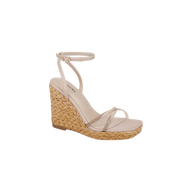 Malone Wedge Espadrille shown on a plain white background, featuring a beige raffia wedge heel, clear toe strap, and a slim ankle strap with a small buckle.