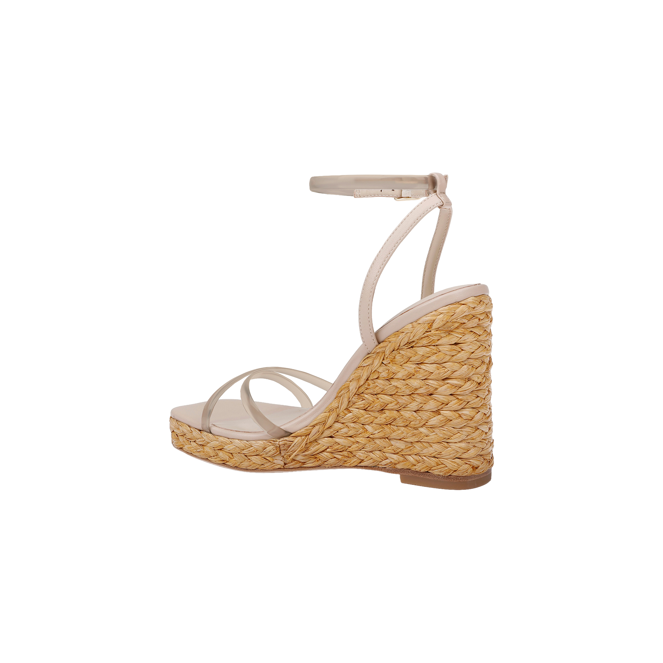 The Malone Wedge Espadrille is a beige strappy sandal with a high raffia wedge heel crafted from woven straw, featuring an ankle strap and a slightly open toe, shown against a white background for an effortless bohemian style look.