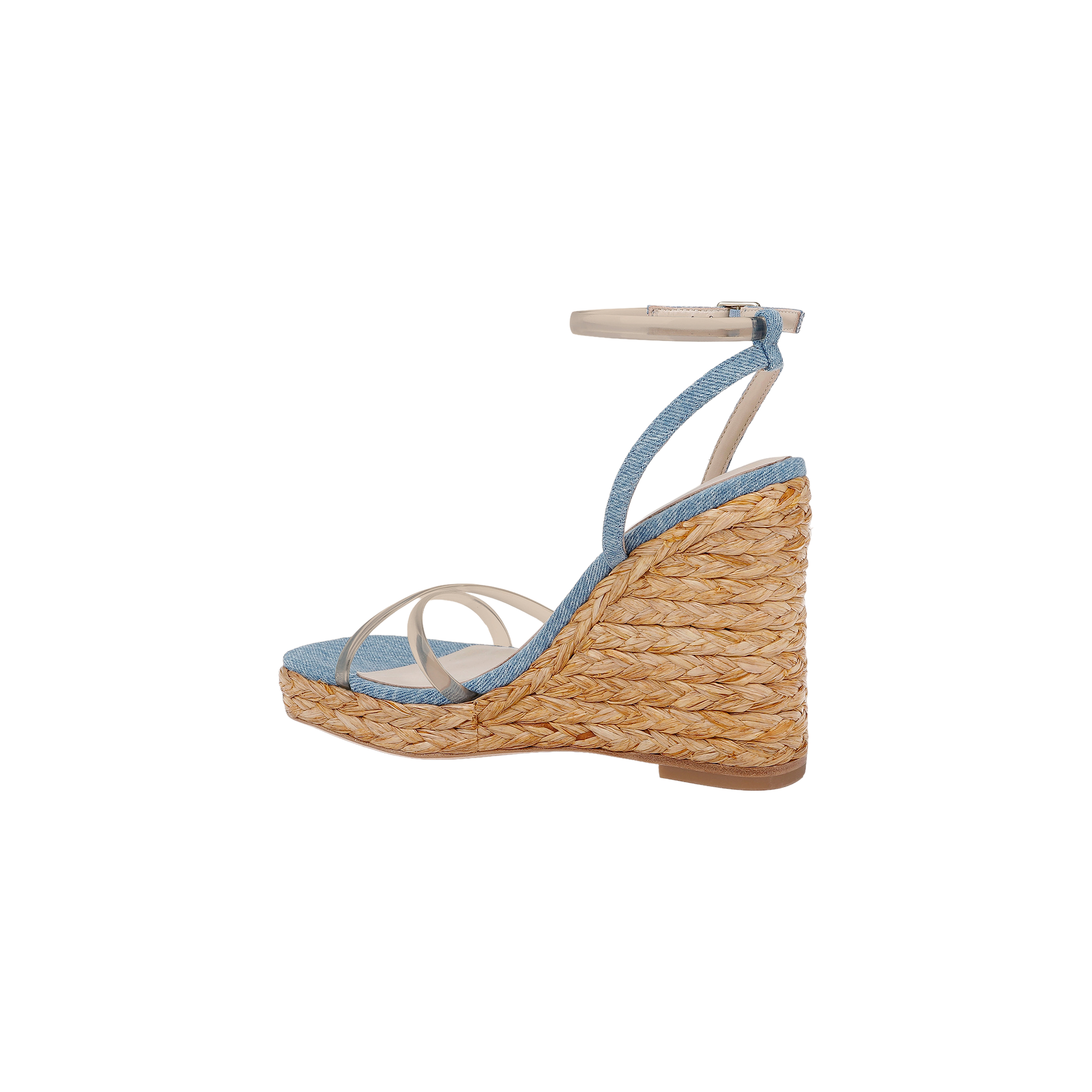 The Malone Wedge Espadrille is a bohemian espadrille wedge sandal featuring a braided straw sole, light blue fabric upper, thin white straps, and an ankle strap with a silver buckle. It includes a comfortable memory foam insole and is shown in profile against a white background.