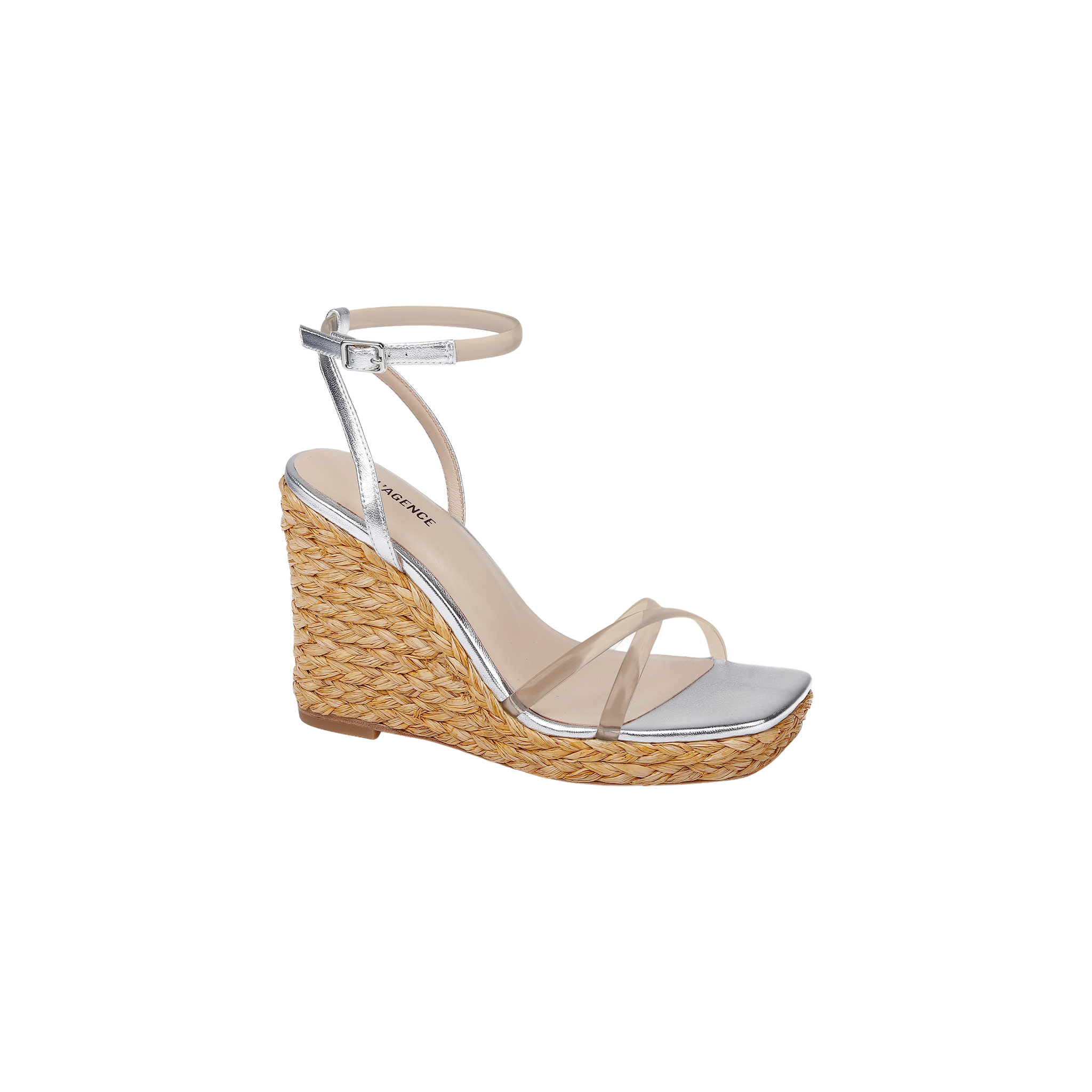 Malone Wedge Espadrille featuring a silver design with a braided raffia wedge platform, clear front strap, ankle strap with buckle, and an open square toe, displayed on a plain white background.