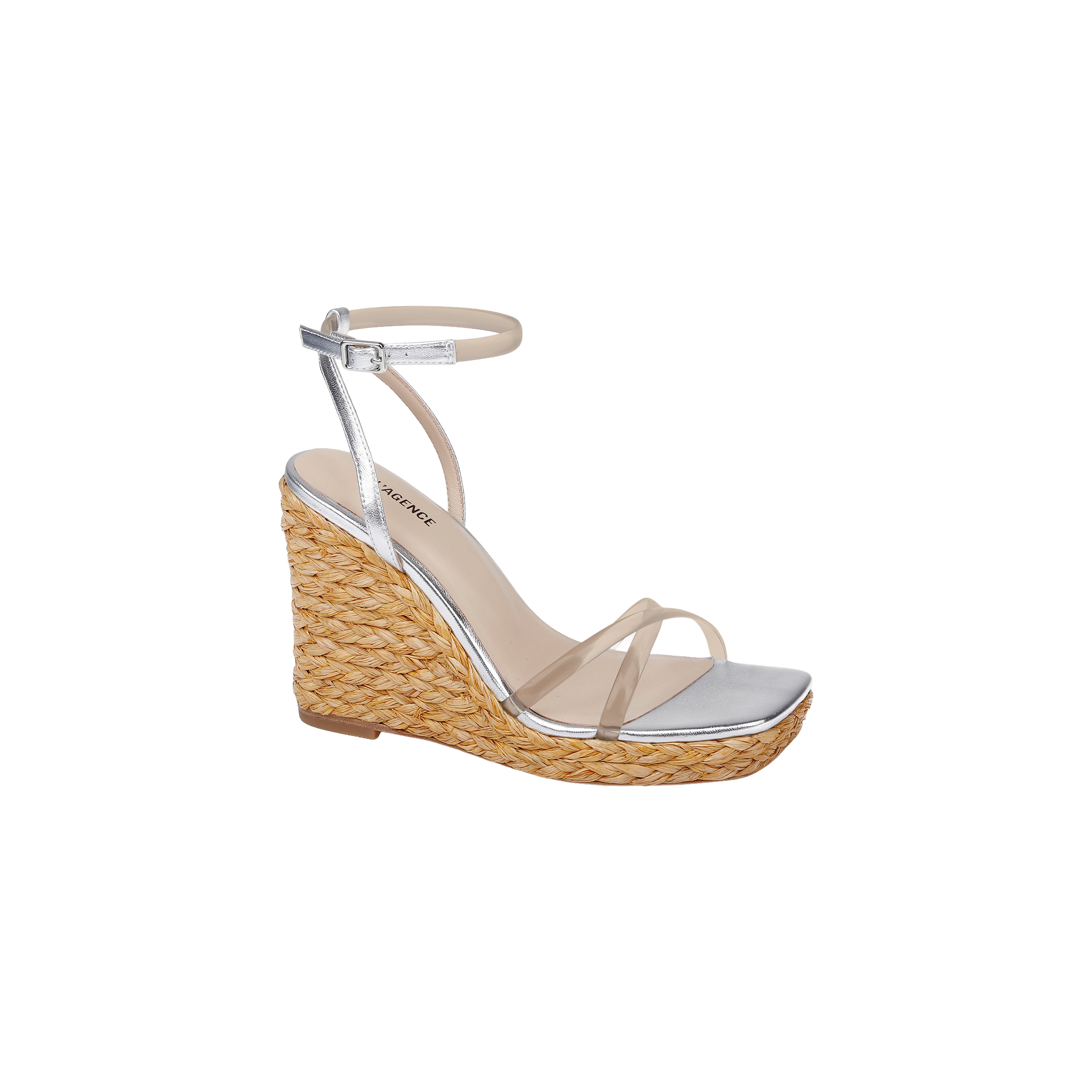 Malone Wedge Espadrille featuring a silver design with a braided raffia wedge platform, clear front strap, ankle strap with buckle, and an open square toe, displayed on a plain white background.