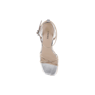 Top view of a single Malone Wedge Espadrille sandal with a silver strappy design, square toe, and ankle strap, crafted from metallic leather and displayed on a white background.