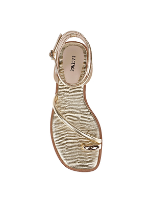 A top view of the Mariana Leather Sandal shows gold lizard-embossed leather, sparkling rhinestones, a thin ankle strap, toe loop, and a light insole labeled L’AGENCE.