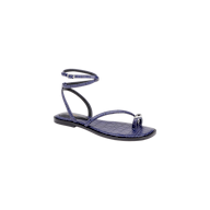 The Mariana Leather Sandal is a purple flat sandal featuring a crocodile texture, a toe ring, and a wraparound ankle tie strap, displayed against a plain white background.