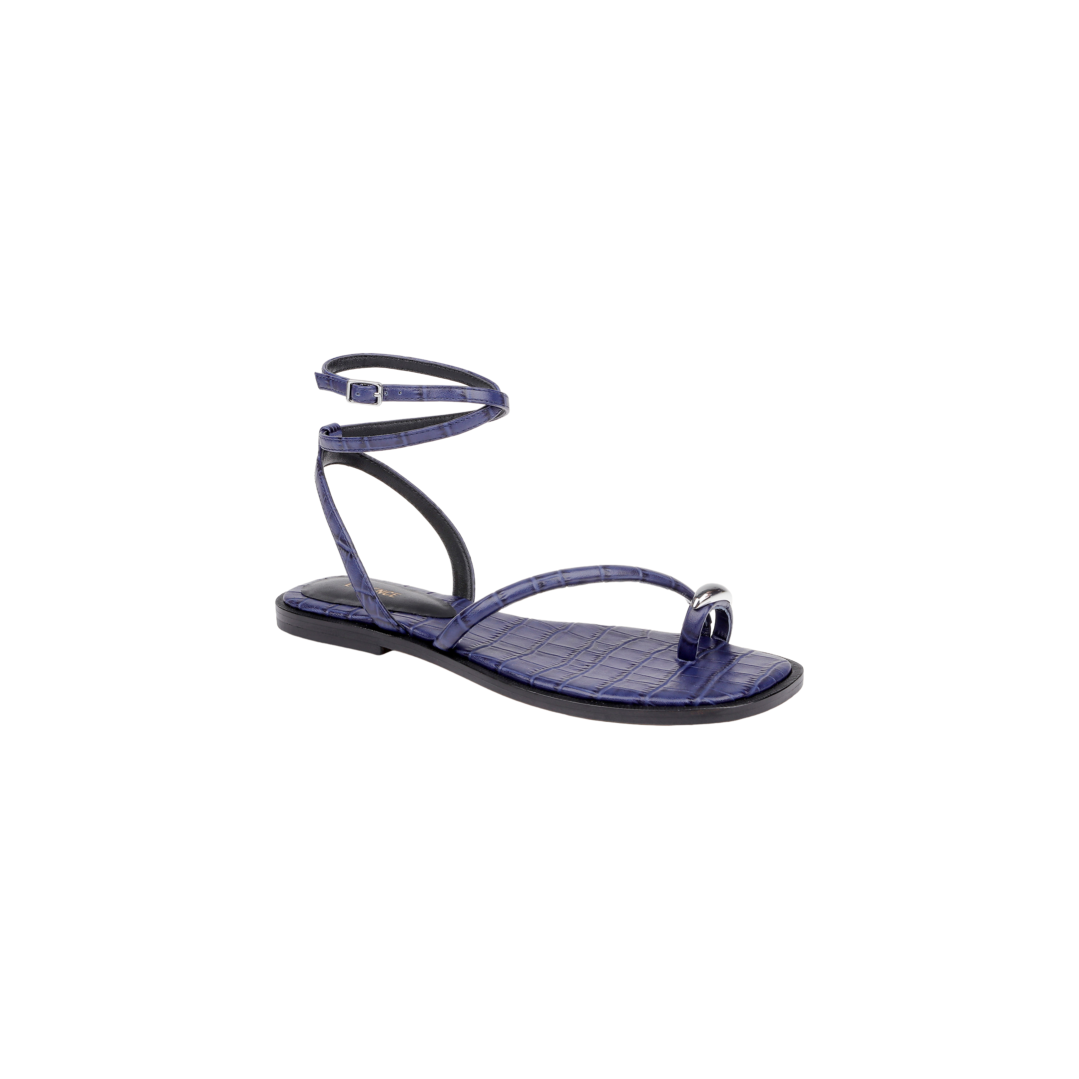 The Mariana Leather Sandal is a purple flat sandal featuring a crocodile texture, a toe ring, and a wraparound ankle tie strap, displayed against a plain white background.