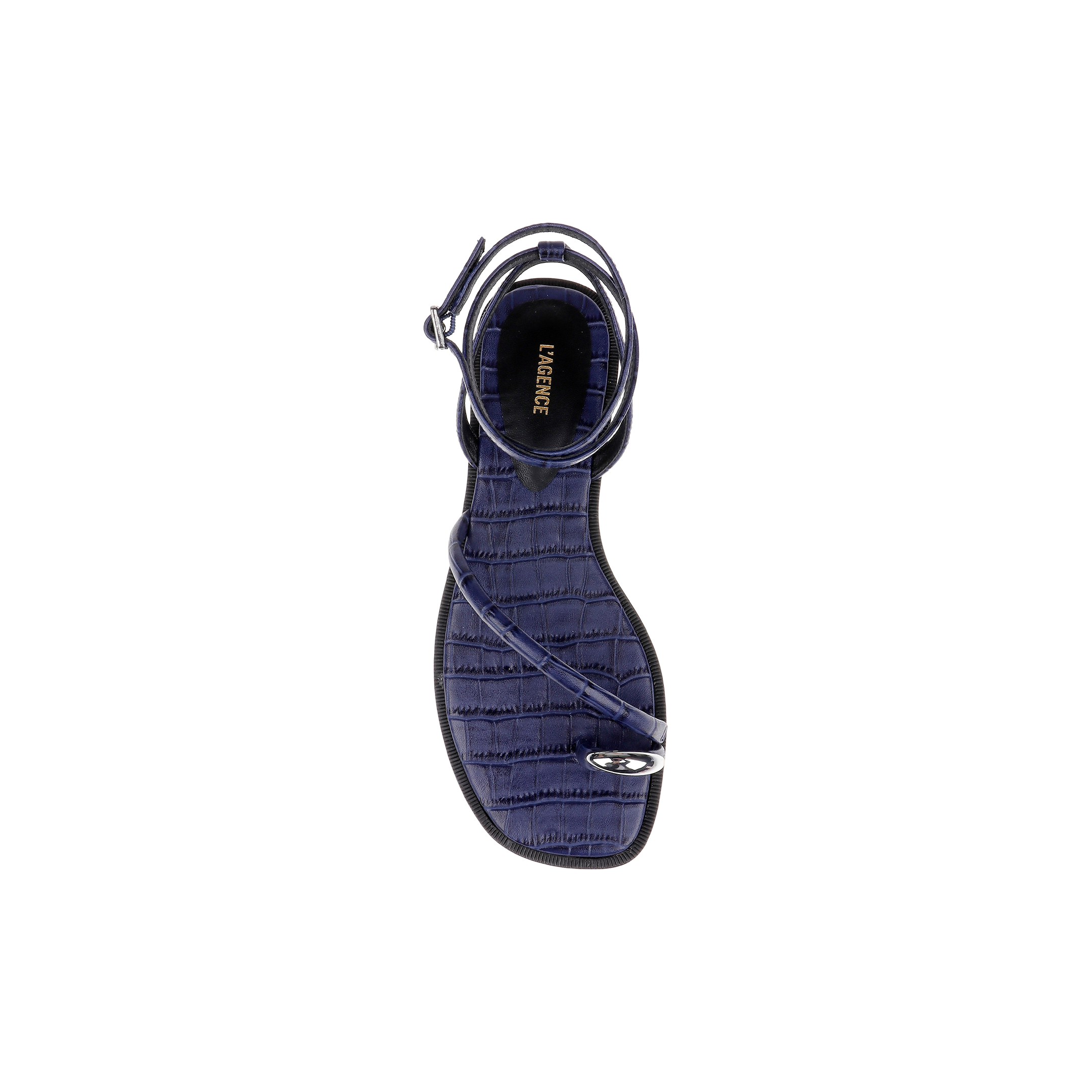 A top view of a single Mariana Leather Sandal in navy croc-embossed leather, featuring a textured pattern, an ankle strap, and a thin front strap with a small metallic detail. “LAGENCE” is written on the insole.