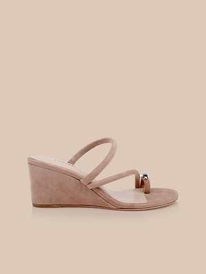 The Maritza Wedge Sandal is a nude suede wedge with two thin top straps and an open toe, shown on a plain beige background.