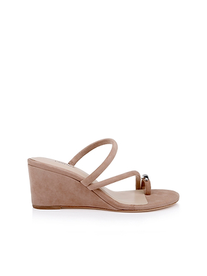 The Maritza Wedge Sandal is a taupe suede sandal featuring a comfortable wedge heel, two slim top straps, and a metal accent on one strap, shown in side profile against a white background.