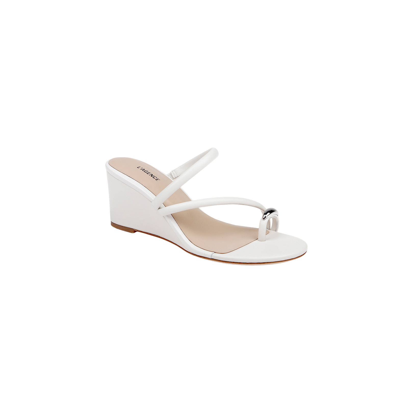The Maritza Wedge Sandal is a white wedge with a minimalist upper, featuring two slim straps—one over the toes detailed with a metallic accent and another crossing the instep. Designed for comfort, it pairs a walkable wedge heel with a beige memory foam insole, while the light brown sole completes the look.