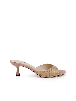 The Maryam Kitten-Heel Mule is a beige minimalist mule sandal with a raffia upper, woven front strap, and open toe, shown on a white background.
