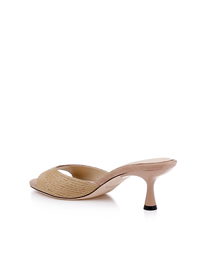 The Maryam Kitten-Heel Mule features a beige raffia upper and an open toe, set on a mid-height stiletto heel. Shown from the rear against a white background, its ideal for a minimalist mule style.