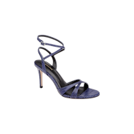 The Miranda Leather Sandal features thin, crisscrossing navy leather straps and an elegant ankle-wrap strap with a buckle, set atop a high heel. Shown on a white background, this sandal is perfect for pairing with evening gowns.