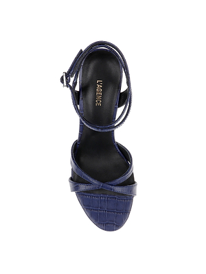 Top view of the Miranda Leather Sandal in navy crocodile-embossed leather, featuring crisscross and ankle-wrap straps with a buckle. The black insole is branded LAGENCE in gold—ideal as stylish evening footwear.