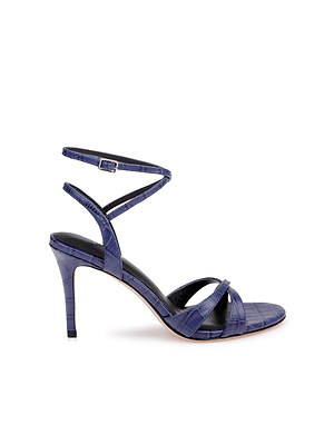 The Miranda Leather Sandal is a single high-heeled shoe in glossy textured navy leather, with thin crisscross toe straps, an adjustable ankle-wrap strap, pointed heel, and open toe—perfect for elegant evenings.