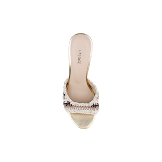 A top view of a single Moyes Crochet Sandal for women, featuring an open toe, a gold sole, and a woven beige and brown strap. The insole, labeled LAGENCE and designed with memory foam for added comfort, is displayed on a plain white background.