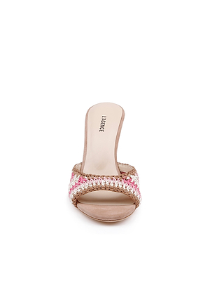 The Moyes Crochet Sandal is a womens open-toe heeled sandal with a beige, pink, and white woven strap, shown from the front on a white background. It features a sculpted heel and signature L. LARABEE insole for effortless summer style.
