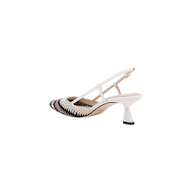 The Nantes Slingback Pump is a white pump with a pointed toe, detailed with black and white woven accents. It features delicate straps with a buckle closure, a mid-height flared heel, and is finished with a memory foam insole for enhanced comfort.