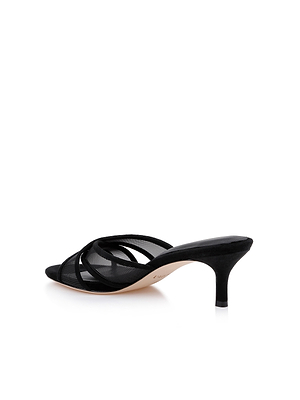 The Padua Mesh Sandal is a black pointed-toe mule with thin crisscross straps, a low stiletto heel, and a memory foam insole, shown against a white background.