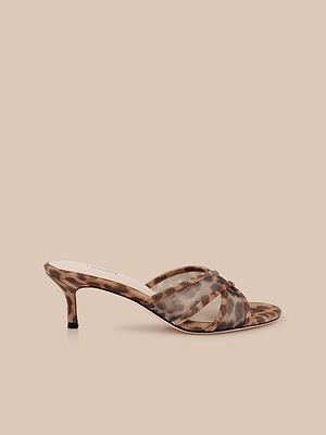 The Padua Mesh Sandal is a single heeled leopard print mule with open toe, crisscross straps, and a comfy memory foam insole, shown on a plain beige background.