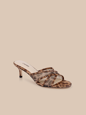 The Padua Mesh Sandal features a brown leopard print, crossed straps, memory foam insole, and a slim high heel, shown on a light beige background.