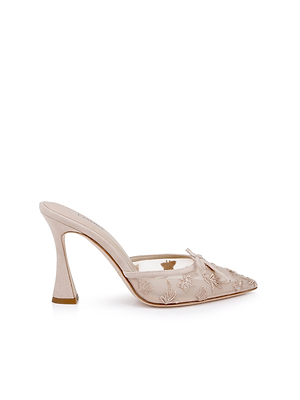 The Prasad Mesh Mule offers elegance in light beige with a pointed toe, transparent upper adorned with butterfly embroidery and floral details, flared heel, and an easy slip-on design for sophisticated style.