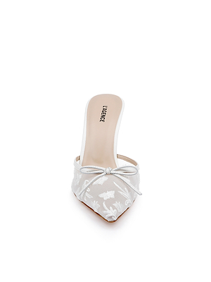 Front view of the Prasad Mesh Mule in white with butterfly embroidery, pointed toe, floral accents, small bow detail, branded LAGENCE insole, and a low block heel.