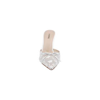 The Prasad Mesh Mule is a white pointed-toe mule crafted from embroidered mesh, adorned with a delicate floral pattern and a small bow on the upper front. It features a low sculpted heel and has the brand name LABERNE printed on the insole near the heel. The background is plain white.