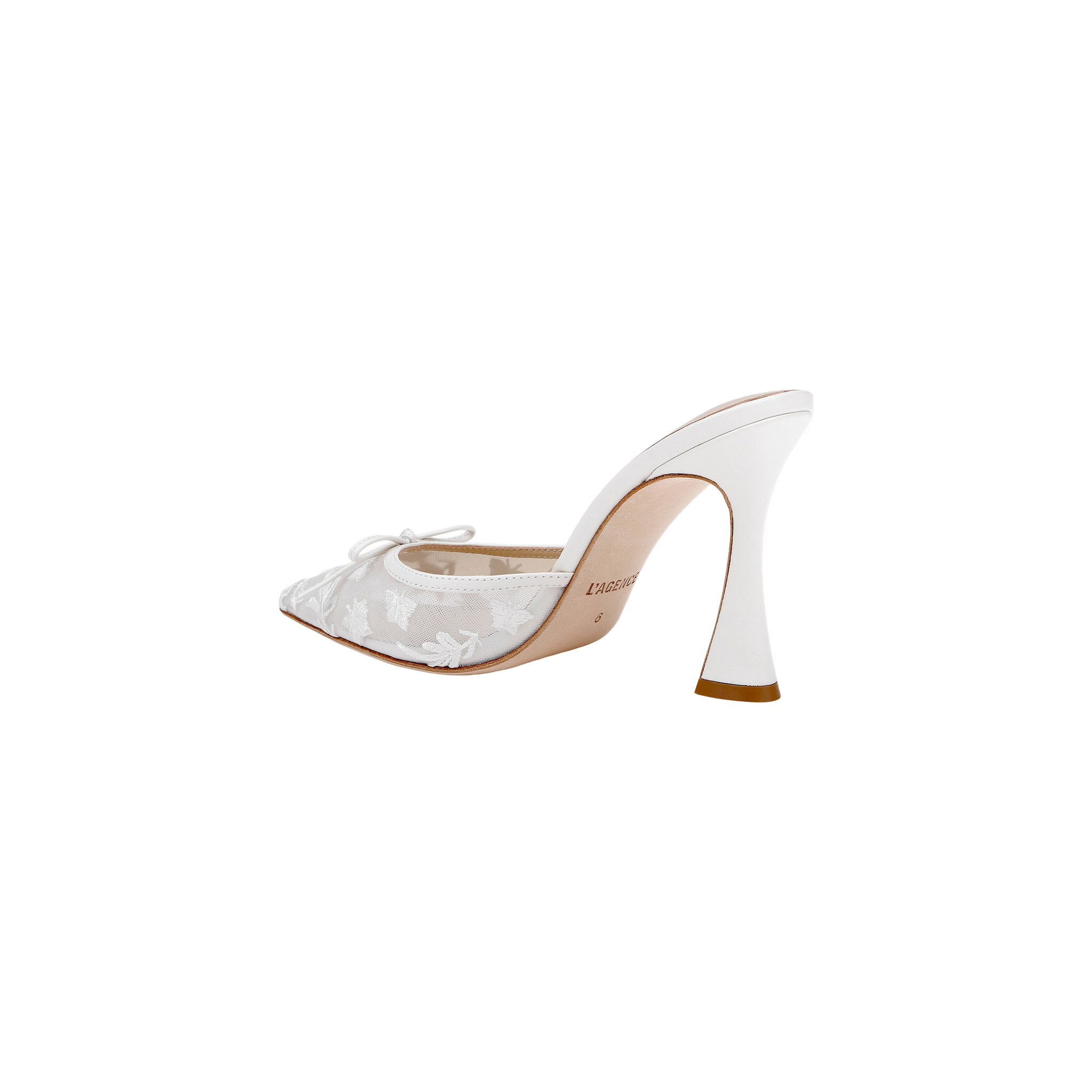 The Prasad Mesh Mule is a white high-heeled shoe featuring a sculpted heel, pointed toe, and delicate lace floral detailing, shown on a plain white background.