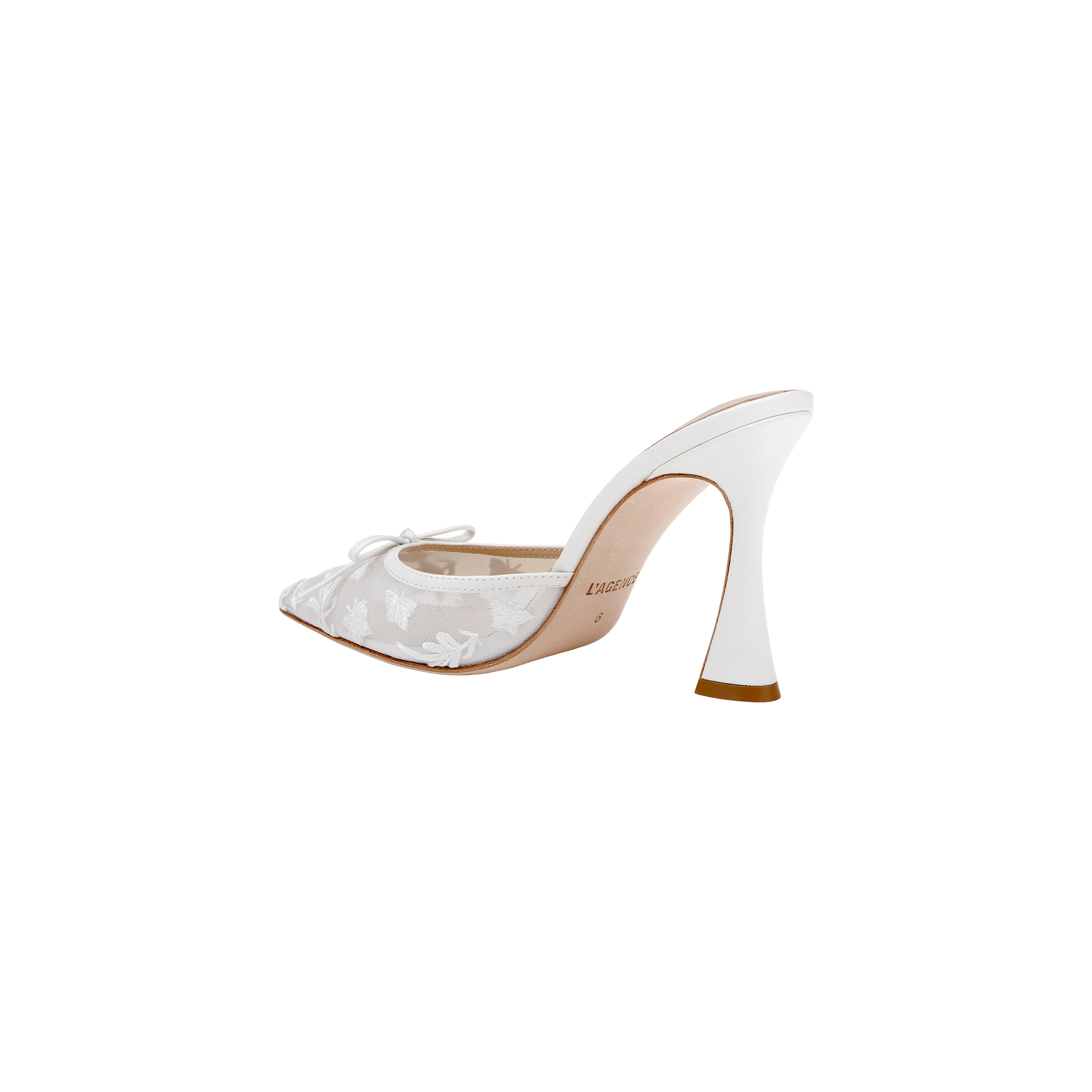 The Prasad Mesh Mule is a white high-heeled shoe featuring a sculpted heel, pointed toe, and delicate lace floral detailing, shown on a plain white background.