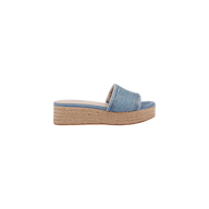 The Ramani Platform Espadrille features a blue denim upper with a wide strap and a platform sole wrapped in braided jute, styled in the classic platform espadrille design. The shoe is displayed in a side profile view against a white background.