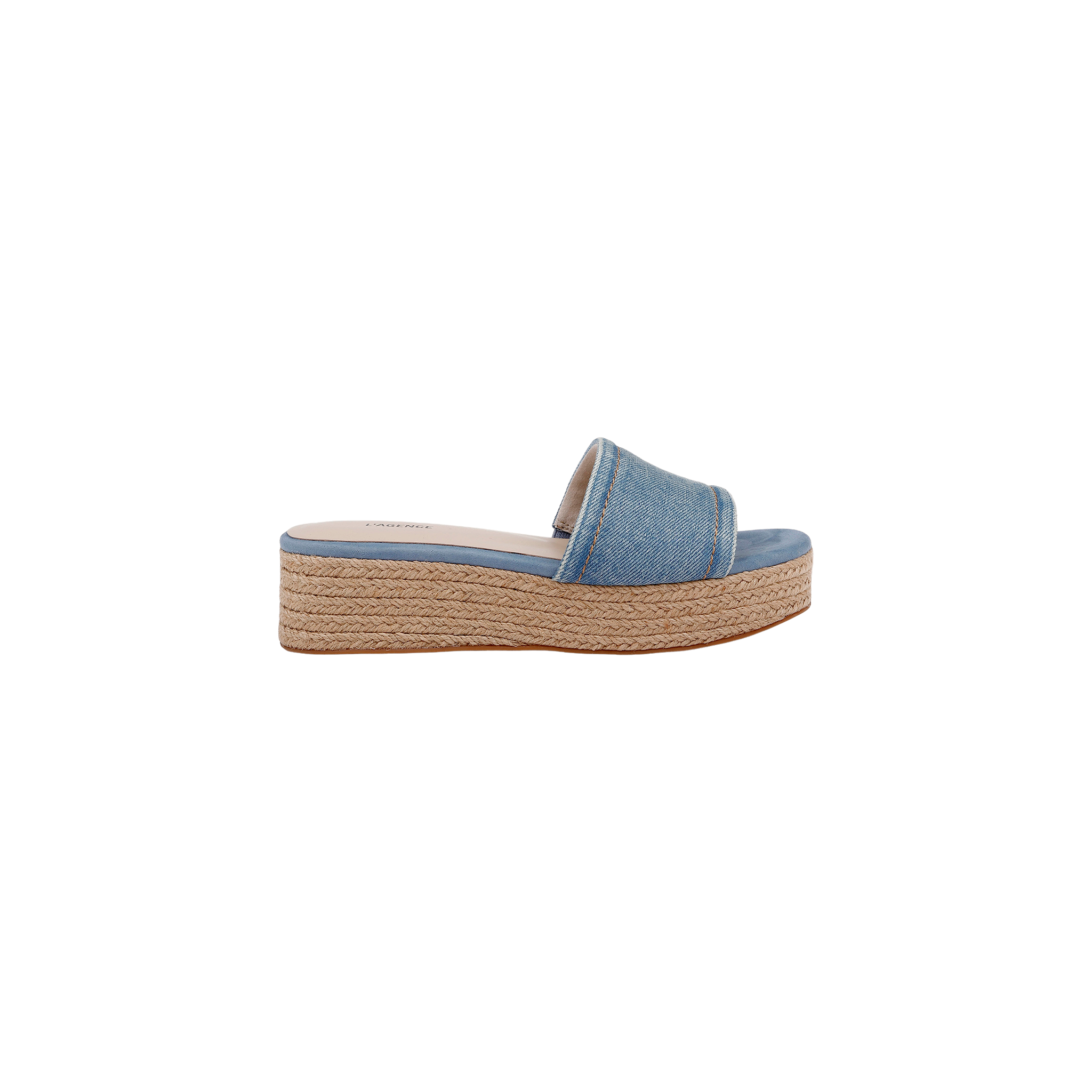 The Ramani Platform Espadrille features a blue denim upper with a wide strap and a platform sole wrapped in braided jute, styled in the classic platform espadrille design. The shoe is displayed in a side profile view against a white background.