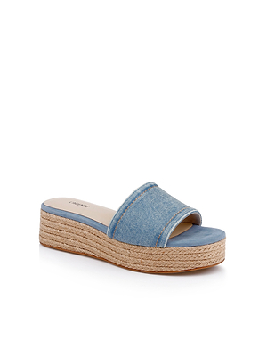 The Ramani Platform Espadrille features a blue denim upper, open toe, wide strap, and a jute-wrapped platform sole—an ideal spring-summer shoe.