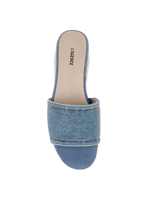 A top view of the Ramani Platform Espadrille shows a blue open-toe slide sandal with a denim espadrille strap and LAGENCE printed on the beige insole—a simple, casual choice with exposed stitching for spring and summer collections.