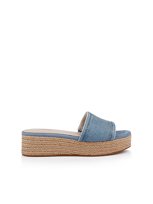 The Ramani Platform Espadrille features a wide single denim strap, open toe, and platform sole with woven jute trim, shown on a white background.