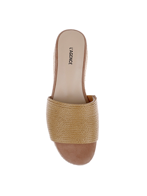 The Ramani Platform Espadrille is a beige slide sandal with a woven strap and open toe, viewed from above on a white background. The insole features the L’AGENCE brand name in black text.