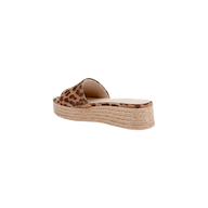 The Ramani Platform Espadrille features a single flat platform slide design with a leopard-printed suede upper and a thick woven jute sole, shown from the back angle on a white background—ideal for summer style.