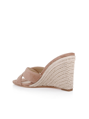 A side view of the Rosaline Wedge Espadrille shows beige crisscross suede straps, a high woven wedge heel, and a memory foam insole, all displayed on a white background.