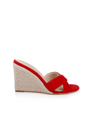 The Rosaline Wedge Espadrille is a red suede sandal with wide criss-cross vamp straps, an open toe, a braided espadrille-style wedge heel, and a light tan insole, shown against a white background.