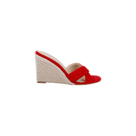 The Rosaline Wedge Espadrille is a red suede open-toe sandal featuring a woven beige espadrille wedge heel and crisscross straps, shown against a plain white background.