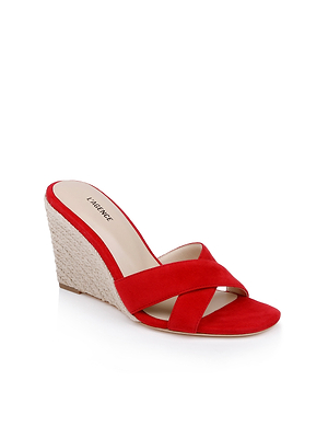 The Rosaline Wedge Espadrille is a single red suede sandal featuring a criss-cross vamp and woven heel, displayed on a white background.