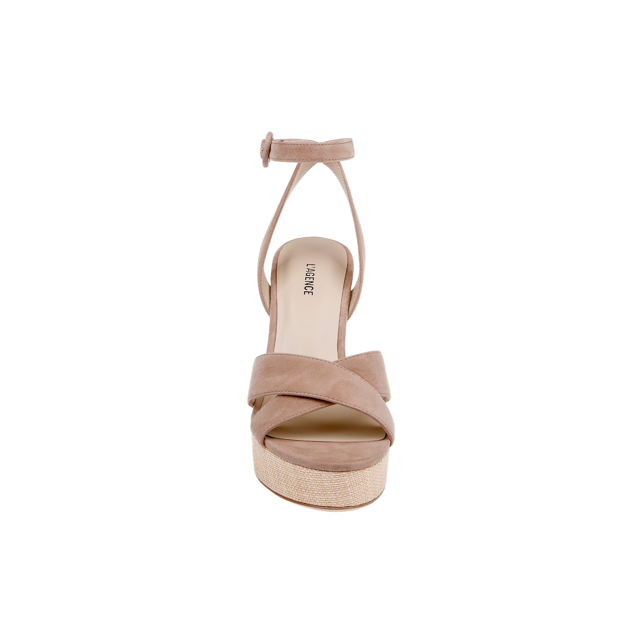The Sandrine Platform Sandal features crossed tan suede straps, an ankle strap with a small buckle, and sits on a raffia-wrapped wedge in beige, shown from the front against a white background.