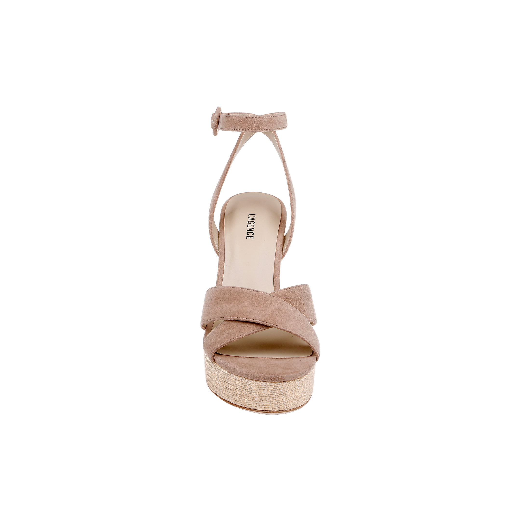 The Sandrine Platform Sandal features crossed tan suede straps, an ankle strap with a small buckle, and sits on a raffia-wrapped wedge in beige, shown from the front against a white background.